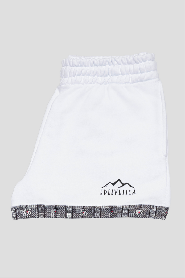 Damen Shorts von Edelvetica mit Edelweiss-Abschluss und Logo, eine modische und praktische Wahl für Freizeitaktivitäten. Diese Shorts zeichnen sich durch ein charakteristisches Edelweiss-Muster am Abschluss und das Edelvetica-Logo aus, was einen Hauch von alpiner Eleganz und Markenidentität verleiht. Ideal für Frauen, die lässige, aber stilvolle Kleidung schätzen.
